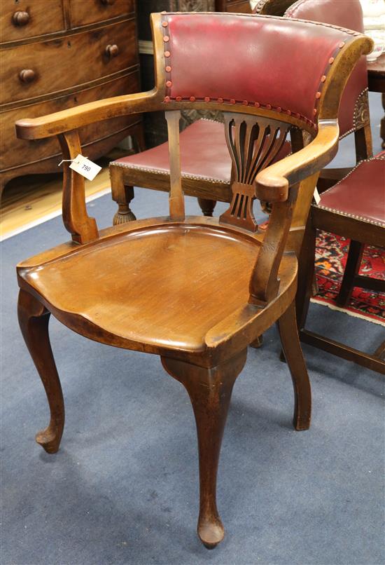A Victorian mahogany wood seat open armchair and four oak side chairs